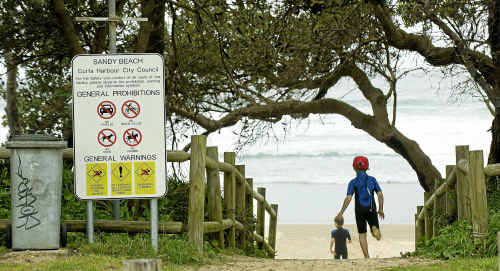 Children return to Sandy Beach, a day after a woman drowned there. Children return to Sandy Beach, a day after a woman drowned there.